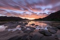 A beautiful landscape of a golden sunset over the mountains and river Royalty Free Stock Photo