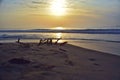 Beautiful long exposure photography of sunrise at sea shore with sea water coming over the sand Royalty Free Stock Photo