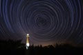 Barnegat Lighthouse under star trails in the sky Royalty Free Stock Photo