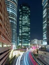 Beautiful long exposure vertical night shot of the La Defense business district in Paris, France