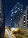 Beautiful long exposure vertical night shot of the La Defense business district in Paris, France