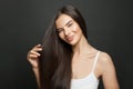 Beautiful long hair. Beauty woman with straight black hair on dark background Royalty Free Stock Photo