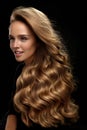 Beautiful Long Hair. Woman Model With Blonde Curly Hair Royalty Free Stock Photo