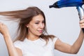 Beautiful long haired woman drying hair in bathroom Royalty Free Stock Photo