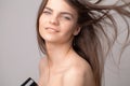 Beautiful long haired woman drying hair in bathroom Royalty Free Stock Photo