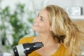 Beautiful long haired woman drying hair in bathroom Royalty Free Stock Photo