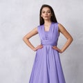 Young woman in purple bandeau maxi dress Royalty Free Stock Photo