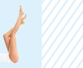 Woman`s legs with smooth skin after depilation on pastel blue background. Royalty Free Stock Photo