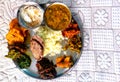 Beautiful looking delicious vegetarian meal plated Indian lunch prepared with multiple food items
