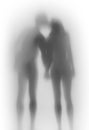 Beautiful lover couple together, body silhouette from behind. Hold each others hand, kiss. Royalty Free Stock Photo