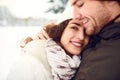 Beautiful loving couple embracing in winter time