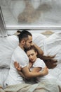 Beautiful loving couple kissing in bed Royalty Free Stock Photo