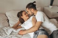 Beautiful loving couple kissing in bed Royalty Free Stock Photo