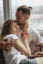 Beautiful loving couple kissing in bed Royalty Free Stock Photo