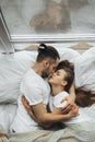 Beautiful loving couple kissing in bed Royalty Free Stock Photo