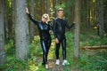 Beautiful loving couple posing in latex rubber costumes