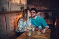 Beautiful loving couple sitting in a cafe drinking coffee Royalty Free Stock Photo