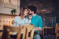 Beautiful loving couple sitting in a cafe drinking coffee and conversating Royalty Free Stock Photo