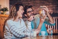 Beautiful loving couple sitting in a cafe drinking coffee and conversating Royalty Free Stock Photo