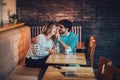 Beautiful loving couple sitting in a cafe drinking coffee Royalty Free Stock Photo