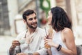 Beautiful loving couple sitting in a cafe enjoying in coffee