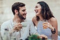 Beautiful loving couple sitting in a cafe enjoying in coffee