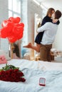 Beautiful loving couple is spending time together at home Attractive young woman in dress and handsome man hugging and love each Royalty Free Stock Photo