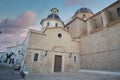 Beautiful low angle shot of a church with a tree. Beautiful architecture in Altea Spain