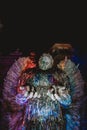 Beautiful low angle view of the knife angel sculpture covered with colorful light