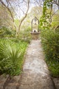 Beautiful Lush Park Walkway and Antique Well Royalty Free Stock Photo