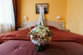 Beautiful lush wedding bouquet on a bed in a bride`s bedroom