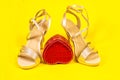 Beautiful luxurious vintage evening elegant women's sandals with rhinestones, high heels, on a yellow background, and Royalty Free Stock Photo