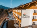 Beautiful luxury Alpine hotel on top of the mountain during spring time.