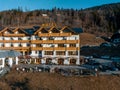 Beautiful luxury Alpine hotel on top of the mountain during spring time.