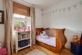 Beautiful luxury bedroom with childrens cot bed