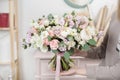 Beautiful luxury bouquet of mixed flowers in woman hand. the work of the florist at a flower shop. Wedding Royalty Free Stock Photo