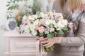 Beautiful luxury bouquet of mixed flowers in woman hand. the work of the florist at a flower shop. Wedding Royalty Free Stock Photo