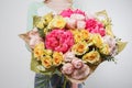 Beautiful luxury bouquet of mixed flowers in woman hand. the work of the florist at a flower shop Royalty Free Stock Photo