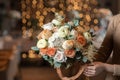 Beautiful luxury bouquet of mixed flowers in woman hand. the work of the florist at a flower shop. Wedding Royalty Free Stock Photo