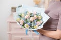 Beautiful luxury bouquet of pink hyacinths flowers in woman hand. the work of the florist at a flower shop. Royalty Free Stock Photo