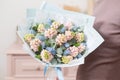 Beautiful luxury bouquet of pink hyacinths flowers in woman hand. the work of the florist at a flower shop. Royalty Free Stock Photo