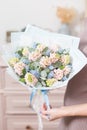 Beautiful luxury bouquet of pink hyacinths flowers in woman hand. the work of the florist at a flower shop. Royalty Free Stock Photo