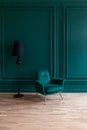 Beautiful luxury classic blue green clean interior room in classic style with green soft armchair. Vintage antique blue Royalty Free Stock Photo