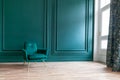 Beautiful luxury classic blue green clean interior room in classic style with green soft armchair. Vintage antique blue Royalty Free Stock Photo