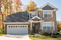 Beautiful Luxury Gray Flagstone Home in Fall Royalty Free Stock Photo