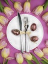 Easter table cutlery with tulips and eggs Royalty Free Stock Photo