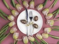 Easter table cutlery with tulips and eggs Royalty Free Stock Photo