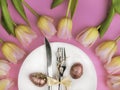 Easter table cutlery with tulips and eggs Royalty Free Stock Photo