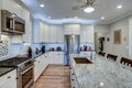 Beautiful luxury kitchen with quartz and granite countertops and white cabinets Royalty Free Stock Photo