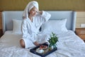 Happy Girl with a Cup of Coffee. Home Style Relaxation Woman Wearing Bathrobe and Towel after Shower. Spa Good Morning Royalty Free Stock Photo